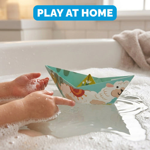 Child playing with a WOYS Insects Set origami paper boat in the bath at home