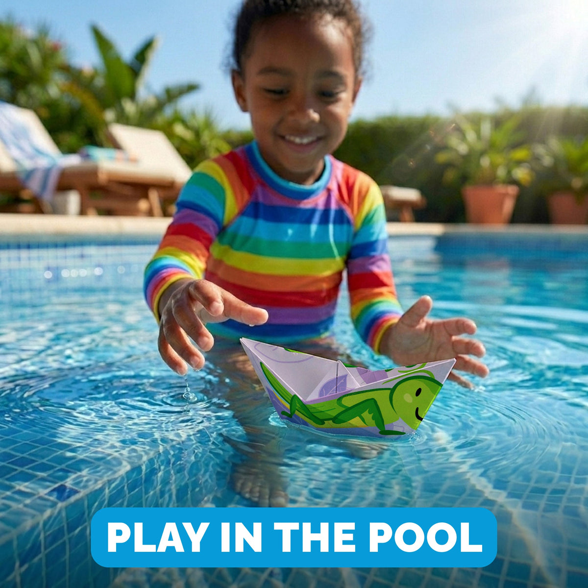 Child playing with a WOYS Insects paper boat in the pool